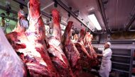 A butcher checks carcasses of beef in a meat refrigerator at the Boucherie St Francois butcher shop in the old city of Nice, France July 28, 2017. Reuters/Eric Gaillard
