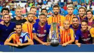 Barcelona celebrate with the trophy after defeating Real Madrid 3 to 2 in their International Champions Cup 2017 match at Hard Rock Stadium on July 29, 2017 in Miami Gardens, Florida. (Chris Trotman/Getty Images/AFP)