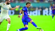 Neymar of Barcelona vies for the ball with Daniel Carvajal of Real Madrid during their International Champions Cup football match at Hard Rock Stadium in Miami, Florida.