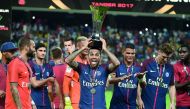 Dani Alves of PSG celebrates after his side beat Monaco at the Grand Stade in Tangiers.