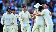 England’s Ben Stokes (second right) celebrates with team-mates after trapping South Africa’s captain Faf du Plessis on day 4 of their third Test at the Oval in London, yesterday. 