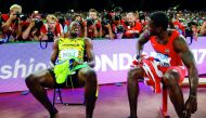Usain Bolt of Jamaica (left) sits on a bench with Justin Gatlin of US after the men’s 200 metres final during the 15th IAAF World Championships at the National Stadium in Beijing, in this August 27, 2015 file photo.