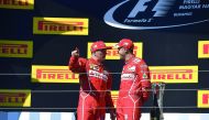 Second-placed Ferrari’s Finnish driver Kimi Raikkonen (left) and winner Ferrari’s German driver Sebastian Vettel stand on the podium after the Formula One Hungarian Grand Prix at the Hungaroring Racing Circuit in Budapest on Sunday. 