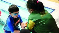 A child from QAFA at a swimming class. 