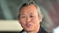South Korean director Kim Ki-Duk speaking during an event at the 19th Busan International Film Festival in Busan on October 5, 2014. AFP / Jung Yeon-Je