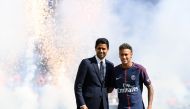 Paris Saint-Germain's Brazilian forward Neymar (R) poses with Paris Saint Germain's (PSG) Qatari president Nasser Al-Khelaifi (L) during his presentation to the fans at the Parc des Princes stadium in Paris, on August 5, 2017. (AFP / ALAIN JOCARD)