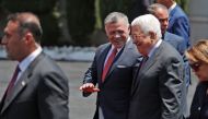 Jordan's King Abdullah II (C) speaks with Palestinian president Mahmud Abbas (2nd-R) upon his arrival in the West Bank city of Ramallah on August 7, 2017. Jordan's King began a rare visit to the occupied West Bank to meet with Palestinain president, amid 