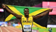 Omar McLeod of Jamaica celebrates after winning the Men's 110 metres hurdles final during the