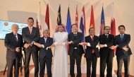 (Center) Haji Nordin Bin Haji Ahmad, Brunei Ambassador to Qatar and Vice Chairman of ACD, Ibrahim Fakhroo, Director of Protocol and Soonthorn Chaiyindeepum, Thailand's Ambassador to Qatar and Chairman of ACD with other officals during the Asean Flag Raisi