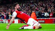 Arsenal’s Olivier Giroud celebrates after scoring their fourth goal against Leicester City in the opening match of English Premier League Premier League in London yesterday.