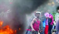 Supporters of the opposition candidate Raila Odinga stage protest against the election results in the slum neighbourhood of Nairobi, Kenya, yesterday.