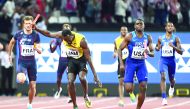 Usain Bolt (centre) falls on Jamaica’s anchor leg of the men’s 4x100m relay final at the 2017 IAAF World Championships in London  yesterday.