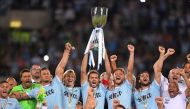 Lazio celebrate winning the Italian Super Cup with the trophy REUTERS/Alberto Lingria