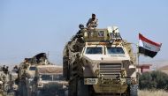 Iraqi government forces advance towards Tal Afar on June 9, 2017, during ongoing battles to retake the city from the Islamic State (IS) group fighters (AFP Photo/MOHAMED EL-SHAHED).