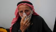 A man breathes through an oxygen mask after what activists said was a chlorine gas attack on Kansafra village at Idlib countryside, Syria May 7, 2015. Reuters/Abed Kontar