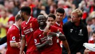 Liverpool's Sadio Mane (C) celebrates scoring their first goal with Liverpool manager Juergen Klopp and team mates Action Images via Reuters/Jason Cairnduff  
