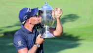 Henrik Stenson poses with the trophy after winning the Wyndham Championship at Sedgefield Country Club in Greensboro, North Carolina on Sunday.