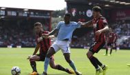 Manchester City's Raheem Sterling in action with Bournemouth's Adam Smith and Andrew Surman . REUTERS/Tony O'Brien