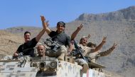 FILE PHOTO: Lebanese army soldiers are seen flashing victory signs in the town of Ras Baalbek, Lebanon August 21, 2017. REUTERS/ Ali Hashisho/ File Photo
