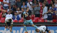 Burnley's New Zealand striker Chris Wood (C) celebrates after scoring their late equalizer during the English Premier League football match between Tottenham Hotspur and Burnley at Wembley Stadium in London, on August 27, 2017.   AFP / Daniel LEAL-OLIVAS