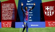 Barcelona's new signing Ousmane Dembele raises hands. REUTERS/Albert Gea
