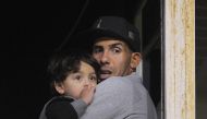 Argentine former Boca Juniors star and current Shanghai Shenhua striker, Carlos Tevez attends the Boca juniors vs Olimpo Argentina First Division Superliga football match at La Bombonera stadium, in Buenos Aires, on August 27, 2017. / AFP / ALEJANDRO PAGN