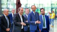 Founder of French broadband Internet provider Iliad, Xavier Niel (3rd L), French Prime Minister Edouard Philippe (2nd R), French Foreign Affairs Minister Jean-Yves Le Drian (L), French Junior Foreign Affairs Minister Jean-Baptiste Lemoyne (C), French Juni