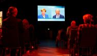 Journalists watch a TV debate between German Chancellor Angela Merkel of the Christian Democratic Union (CDU) and her challenger Germany's Social Democratic Party SPD candidate for chancellor Martin Schulz in Berlin, Germany, September 3, 2017. Reuters/Fa