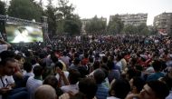 Syrian football fans watch in Damascus the FIFA World Cup 2018 qualification football match between Iran and Syria, played in Iran, on September 5, 2017.  AFP / LOUAI BESHARA
