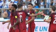USA's Bobby Wood (2-R) celebrates with teammates Michael Bradley (L), Kellyn Acosta (2-L), Clint Dempsey (3-L) and Paul Arriola (R) after scoring against Honduras during their 2018 World Cup football qualifier match in San Pedro Sula, Honduras, on Septemb