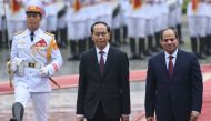 Egypt's President Abdel Fattah al-Sisi (R) and his Vietnamese counterpart Tran Dai Quang (C) review an honour guard during a welcoming ceremony at the presidential palace in Hanoi on September 6, 2017.   AFP / HOANG DINH NAM
