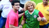 Former Colombian footballer Carlos Valderrama (right), who played in three World Cup tournaments, poses for pictures with former Indian cricket captain Sourabh Ganguly during an event ahead of the FIFA U-17 World Cup tournament in India, in Kolkata yester