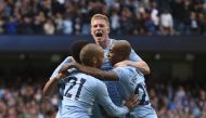 Manchester City's Brazilian striker Gabriel Jesus (L) celebrates with teammates after scoring their third goal during the English Premier League football match between Manchester City and Liverpool at the Etihad Stadium in Manchester, north west England, 