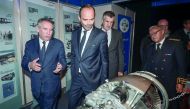 Pau mayor Francois Bayrou (C), French Prime Minister Edouard Philippe (L), French lawmaker Jean Lassalle (Rear C) and prefect of the Pyrenees Atlantiques department, Gilbert Payet (R) visit the stand of French multinational aircraft engine, rocket engine,