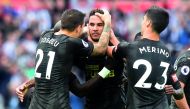 Newcastle United’s Jamaal Lascelles (centre) celebrates his goal with team-mates during the Premier League match against Swansea City in Swansea, yesterday.