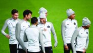Paris Saint-Germain’s Brazilian forward Neymar (centre) laughs with team-mates during a training session at the Camp des Loges in Saint-Germain en Laye yesterday, on the eve of their Champions League match against Celtic FC.