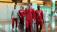 World high jump champion Mutaz Essa Barshim (second right), bronze medallist at the IAAF World Championships in London, Abderrahman Samba (right), Ashraf Elseify and Ahmed Bedeir arrive at the Hamad International Airport in Doha yesterday.  Picture: Abdul