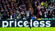 Paris Saint-Germain’s Neymar celebrates after scoring their first goal against Celtic during their opening Champions League Group B match played at Celtic Park in Glasgow, Britain yesterday. Paris St Germain won 5-0 as the world’s most expensive frontline