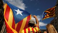People wave Estelads (Catalan separatist flag) as they gather ahead of a rally on the regional national day 'La Diada' in Barcelona, Spain, September 11, 2017. REUTERS/Susana Vera 