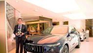 A senior official of the Maserati Qatar, Alfardan Sports Motors, posing with the award.