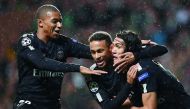 PSG’s Brazilian striker Neymar (centre) celebrates with French striker Kylian Mbappe (left) and Uruguayan striker Edinson Cavani after scoring the opening goal of the match on Tuesday.