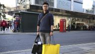 A Chinese tourist, Jasper Zhang, poses for a portrait on New Bond Street in London, October 5, 2016.  Reuters/Neil Hall