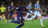 (FILES) This file photo taken on September 09, 2017 shows Barcelona's French forward Ousmane Dembele kicking the ball during the Spanish Liga football match Barcelona vs Espanyol at the Camp Nou stadium in Barcelona on September 9, 2017.  AFP / LLUIS GENE