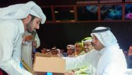 Prime Minister and Interior Minister H E Sheikh Abdullah bin Nasser bin Khalifa Al Thani launching new logo of Qatar Post.