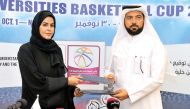 Hamad Bin Khalifa University’s (HBKU) Vice-President of Student Affairs Ms. Maryam Al Mannai (left) and Qatar Basketball Federation’s (QBF) Secretary-General Ali Al Malki exchanging the MoUs on enabling both parties to collaborate more closely on student 
