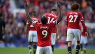 Manchester United's Belgian striker Romelu Lukaku celebrates after scoring their third goal during the English Premier League football match between Manchester United and Everton at Old Trafford in Manchester, north west England, on September 17, 2017.  /