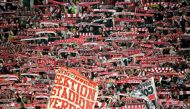 Cologne's supporters cheer their team during the German first division Bundesliga football match Borussia Dortmund v FC Cologne in Dortmund, western Germany, on September 17, 2017.  AFP / SASCHA SCHUERMANN