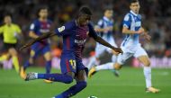 (FILES) This file photo taken on September 09, 2017 shows Barcelona's French forward Ousmane Dembele kicking the ball during the Spanish Liga football match Barcelona vs Espanyol at the Camp Nou stadium in Barcelona on September 9, 2017.  AFP / LLUIS GENE