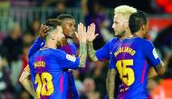 Barcelona’s forward Lionel Messi (left) celebrates with team-mates after scoring during the Spanish league match against SD Eibar at the Camp Nou Stadium in Barcelona on Tuesday.