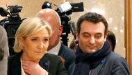 FILE PHOTO - Marine Le Pen (L), French National Front (FN) political party leader and then candidate for French 2017 presidential election, flanked by National Front (FN) party vice-president Florian Philippot (R), arrives to deliver a speech in Paris, Fr
